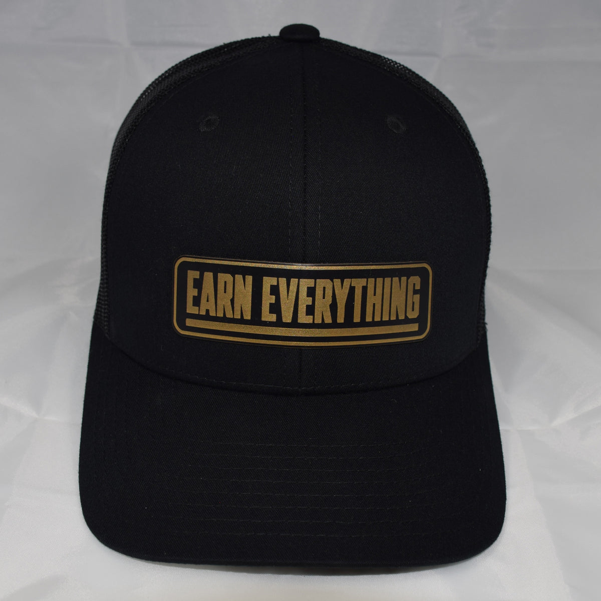 Earn Everything Mesh-Back Trucker Hat – Leatherette Patch